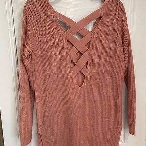 Knit sweater in a peachy pink color